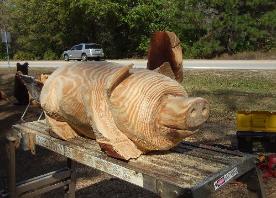 Pig chainsaw carving Florida
