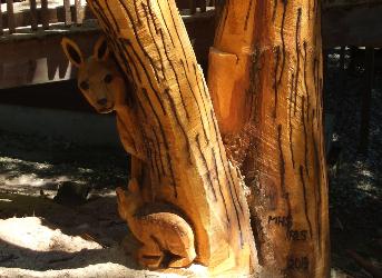 On site tree stump carving burned and stained
